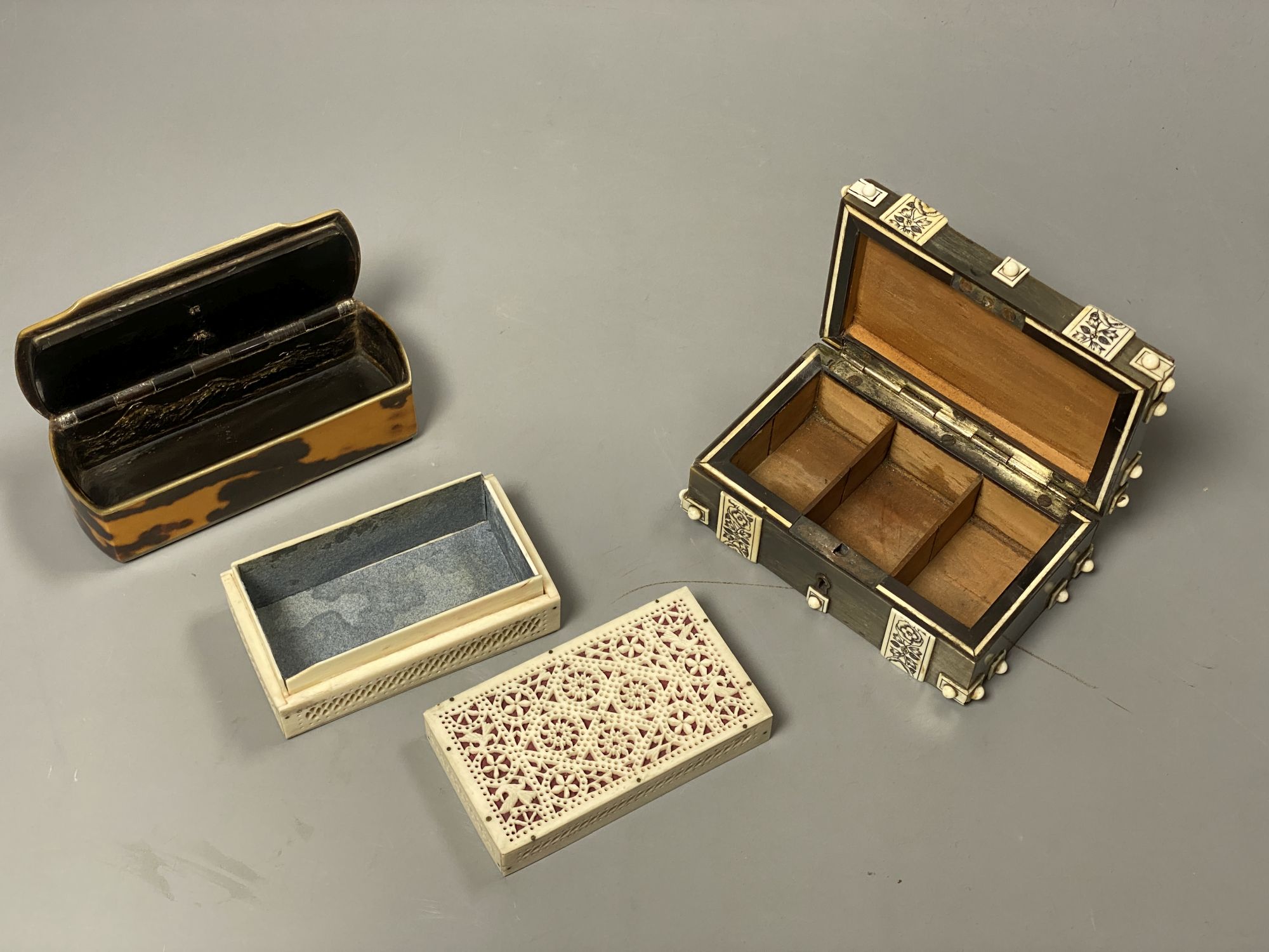 Three boxes including a horn veneered box, a tortoiseshell and bone